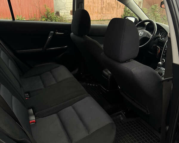 Черный Мазда 6, объемом двигателя 2 л и пробегом 309 тыс. км за 3700 $, фото 12 на Automoto.ua