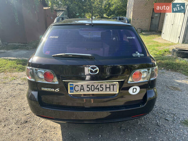 Черный Мазда 6, объемом двигателя 2 л и пробегом 220 тыс. км за 4900 $, фото 4 на Automoto.ua