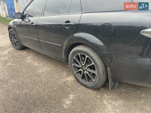 Черный Мазда 6, объемом двигателя 1.8 л и пробегом 251 тыс. км за 6200 $, фото 13 на Automoto.ua