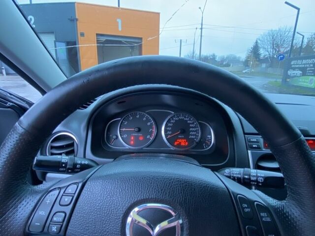 Черный Мазда 6, объемом двигателя 2 л и пробегом 140 тыс. км за 5700 $, фото 9 на Automoto.ua