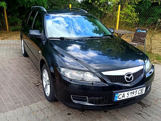 Черный Мазда 6, объемом двигателя 2 л и пробегом 325 тыс. км за 5800 $, фото 1 на Automoto.ua