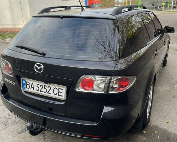 Черный Мазда 6, объемом двигателя 1.8 л и пробегом 251 тыс. км за 6200 $, фото 2 на Automoto.ua