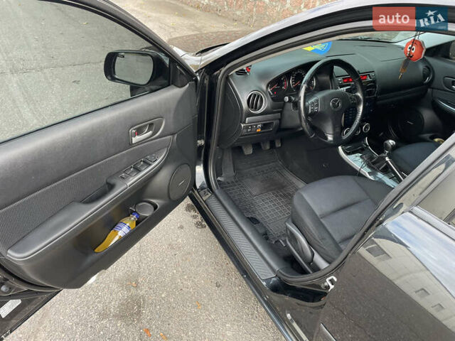 Черный Мазда 6, объемом двигателя 1.8 л и пробегом 251 тыс. км за 6200 $, фото 18 на Automoto.ua