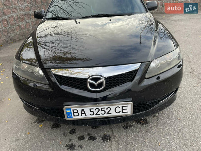 Черный Мазда 6, объемом двигателя 1.8 л и пробегом 251 тыс. км за 6200 $, фото 1 на Automoto.ua