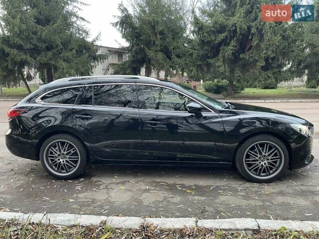 Черный Мазда 6, объемом двигателя 2.18 л и пробегом 175 тыс. км за 11000 $, фото 13 на Automoto.ua