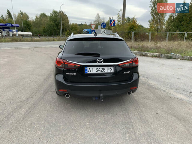 Чорний Мазда 6, об'ємом двигуна 2.19 л та пробігом 252 тис. км за 10999 $, фото 4 на Automoto.ua