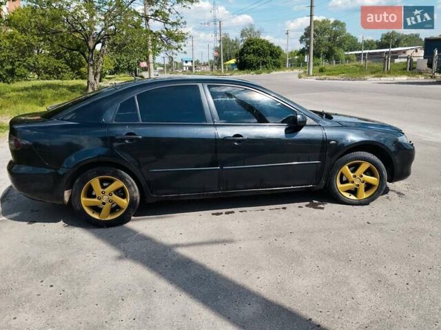 Чорний Мазда 6, об'ємом двигуна 2 л та пробігом 316 тис. км за 4700 $, фото 9 на Automoto.ua