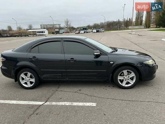 Черный Мазда 6, объемом двигателя 2 л и пробегом 238 тыс. км за 4300 $, фото 1 на Automoto.ua