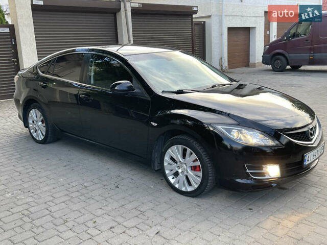 Черный Мазда 6, объемом двигателя 1.8 л и пробегом 245 тыс. км за 6000 $, фото 1 на Automoto.ua
