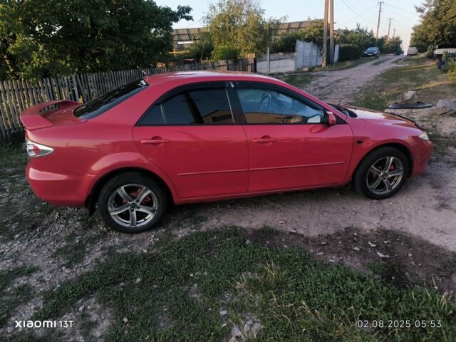 Красный Мазда 6, объемом двигателя 2 л и пробегом 306 тыс. км за 4400 $, фото 1 на Automoto.ua