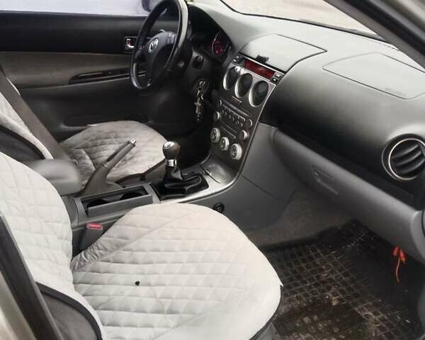 Желтый Мазда 6, объемом двигателя 2 л и пробегом 340 тыс. км за 3600 $, фото 12 на Automoto.ua