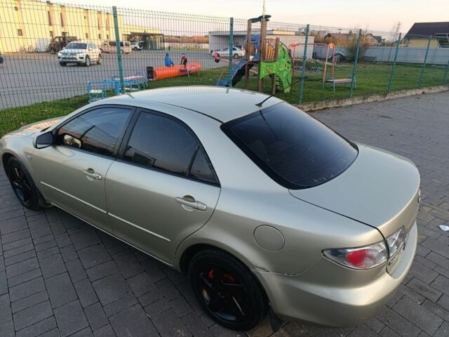 Жовтий Мазда 6, об'ємом двигуна 2 л та пробігом 330 тис. км за 3399 $, фото 6 на Automoto.ua