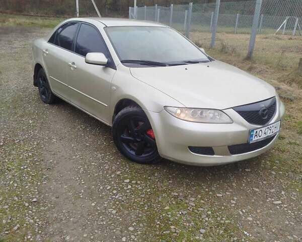 Желтый Мазда 6, объемом двигателя 2 л и пробегом 340 тыс. км за 3600 $, фото 1 на Automoto.ua