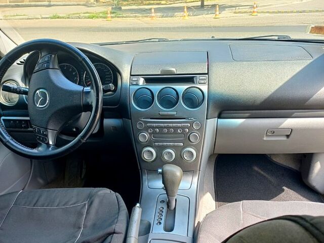 Сірий Мазда 6, об'ємом двигуна 2 л та пробігом 318 тис. км за 4950 $, фото 3 на Automoto.ua