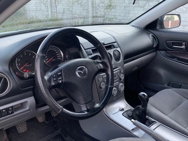 Серый Мазда 6, объемом двигателя 2 л и пробегом 412 тыс. км за 4000 $, фото 1 на Automoto.ua