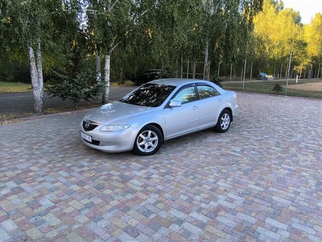 Серый Мазда 6, объемом двигателя 2 л и пробегом 243 тыс. км за 3900 $, фото 1 на Automoto.ua