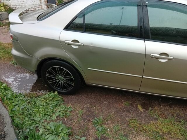 Серый Мазда 6, объемом двигателя 2 л и пробегом 215 тыс. км за 3800 $, фото 4 на Automoto.ua