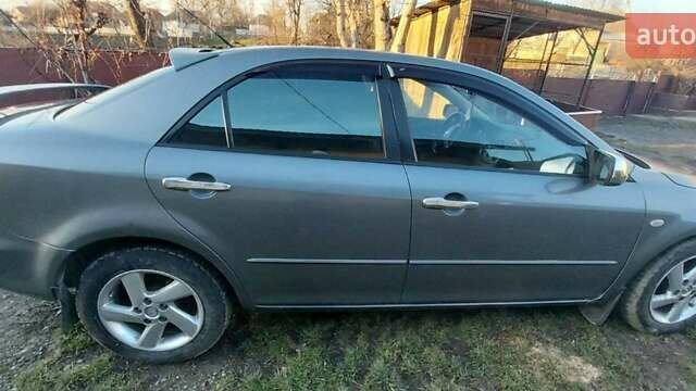 Сірий Мазда 6, об'ємом двигуна 2 л та пробігом 273 тис. км за 3300 $, фото 1 на Automoto.ua
