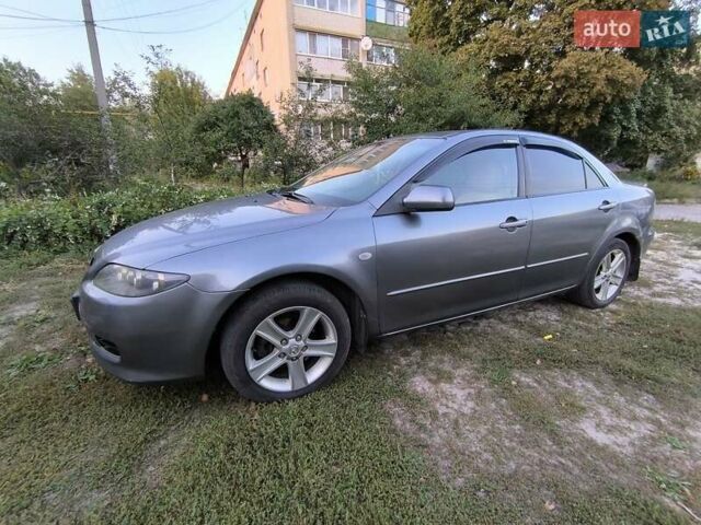 Серый Мазда 6, объемом двигателя 2 л и пробегом 260 тыс. км за 6000 $, фото 2 на Automoto.ua