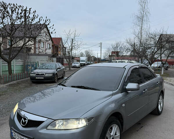 Серый Мазда 6, объемом двигателя 2 л и пробегом 323 тыс. км за 4750 $, фото 1 на Automoto.ua