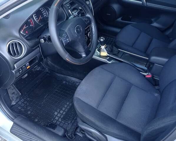 Серый Мазда 6, объемом двигателя 2 л и пробегом 252 тыс. км за 5700 $, фото 1 на Automoto.ua