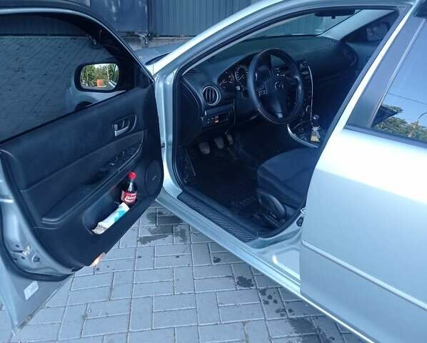 Серый Мазда 6, объемом двигателя 2 л и пробегом 252 тыс. км за 5700 $, фото 2 на Automoto.ua