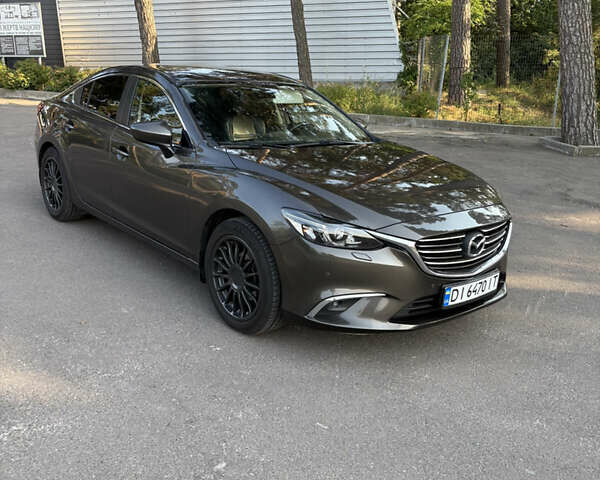 Серый Мазда 6, объемом двигателя 2.19 л и пробегом 167 тыс. км за 14499 $, фото 1 на Automoto.ua
