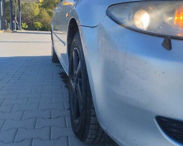 Серый Мазда 6, объемом двигателя 2 л и пробегом 300 тыс. км за 1750 $, фото 3 на Automoto.ua