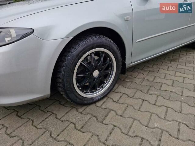 Сірий Мазда 6, об'ємом двигуна 2 л та пробігом 215 тис. км за 4250 $, фото 3 на Automoto.ua