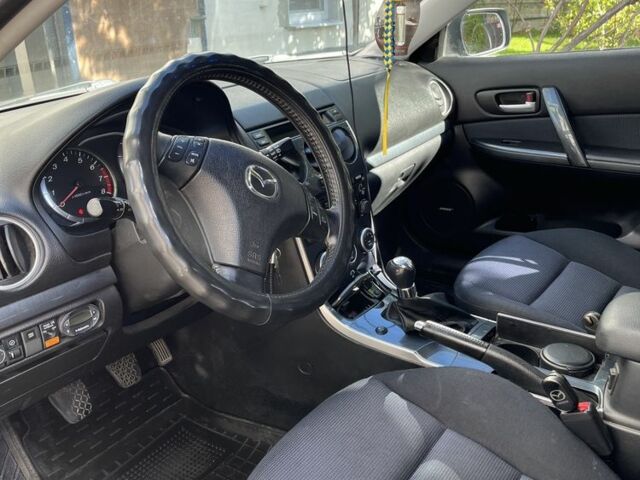Серый Мазда 6, объемом двигателя 2 л и пробегом 230 тыс. км за 5200 $, фото 2 на Automoto.ua