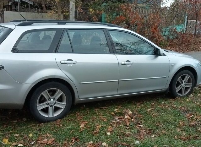 Серый Мазда 6, объемом двигателя 2 л и пробегом 247 тыс. км за 4000 $, фото 1 на Automoto.ua