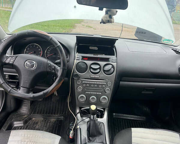 Сірий Мазда 6, об'ємом двигуна 2 л та пробігом 326 тис. км за 3900 $, фото 5 на Automoto.ua