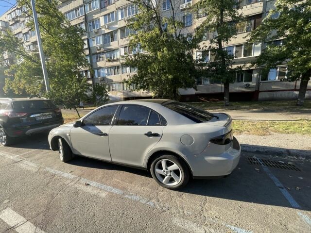 Серый Мазда 6, объемом двигателя 2 л и пробегом 245 тыс. км за 3700 $, фото 1 на Automoto.ua