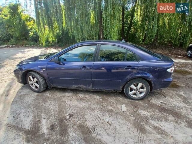 Синій Мазда 6, об'ємом двигуна 2 л та пробігом 304 тис. км за 2058 $, фото 18 на Automoto.ua