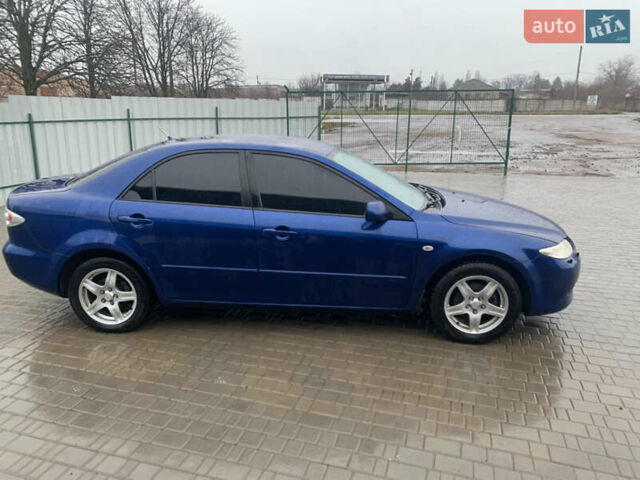 Синій Мазда 6, об'ємом двигуна 2.3 л та пробігом 257 тис. км за 5500 $, фото 2 на Automoto.ua