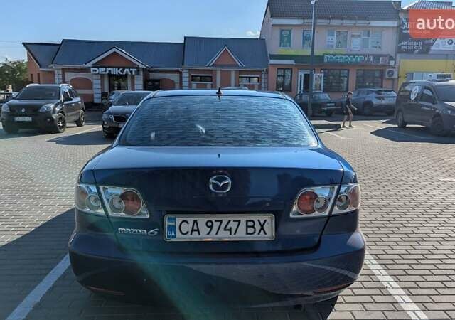 Синий Мазда 6, объемом двигателя 1.8 л и пробегом 323 тыс. км за 3900 $, фото 3 на Automoto.ua