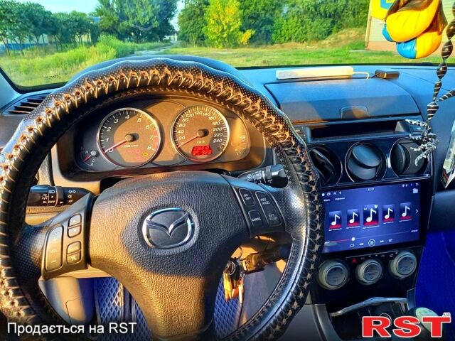 Синий Мазда 6, объемом двигателя 1.8 л и пробегом 240 тыс. км за 3800 $, фото 4 на Automoto.ua