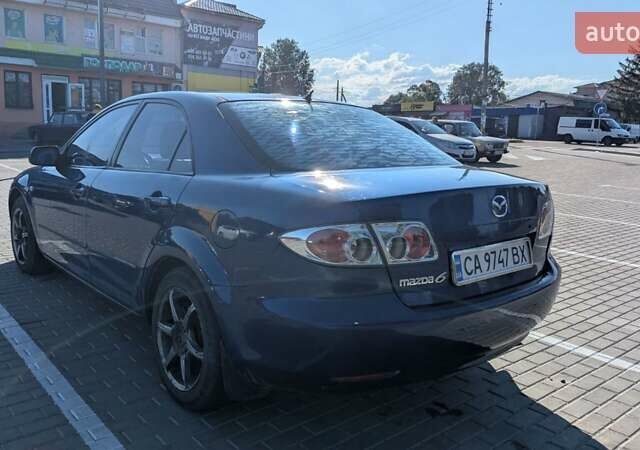 Синий Мазда 6, объемом двигателя 1.8 л и пробегом 323 тыс. км за 3900 $, фото 1 на Automoto.ua