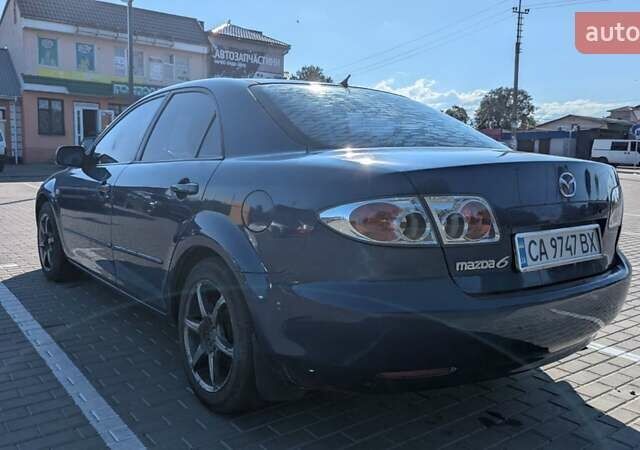 Синий Мазда 6, объемом двигателя 1.8 л и пробегом 323 тыс. км за 3900 $, фото 2 на Automoto.ua