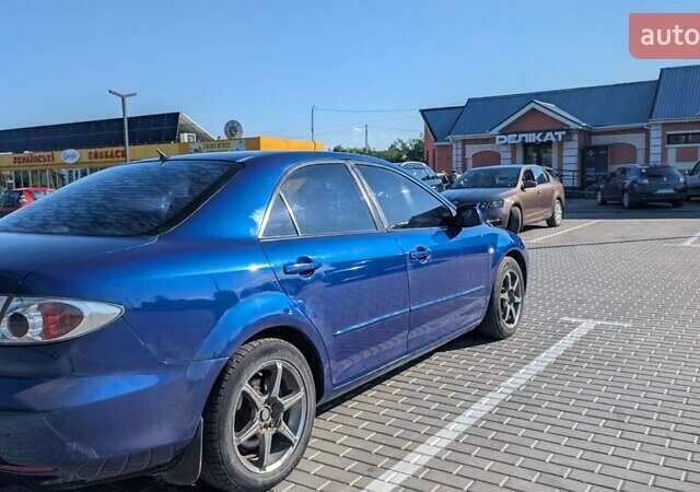 Синий Мазда 6, объемом двигателя 1.8 л и пробегом 323 тыс. км за 3900 $, фото 7 на Automoto.ua