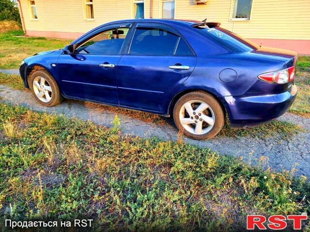 Синий Мазда 6, объемом двигателя 1.8 л и пробегом 240 тыс. км за 3800 $, фото 1 на Automoto.ua