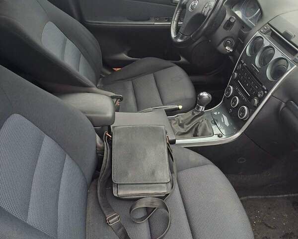 Синий Мазда 6, объемом двигателя 2 л и пробегом 220 тыс. км за 4500 $, фото 2 на Automoto.ua