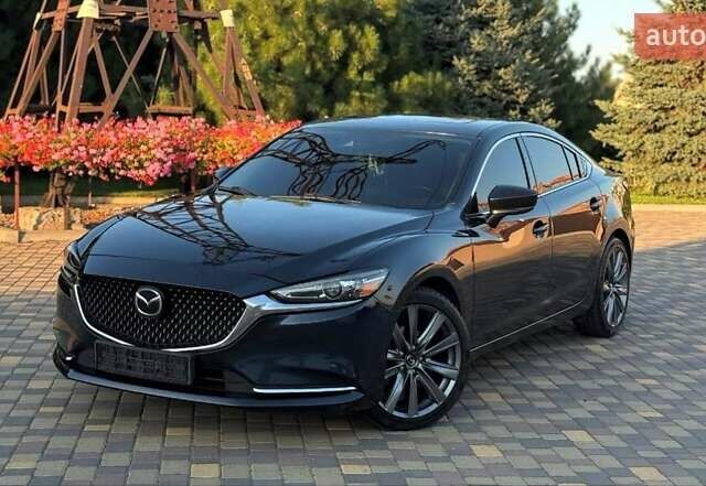 Синий Мазда 6, объемом двигателя 2.49 л и пробегом 96 тыс. км за 16000 $, фото 2 на Automoto.ua
