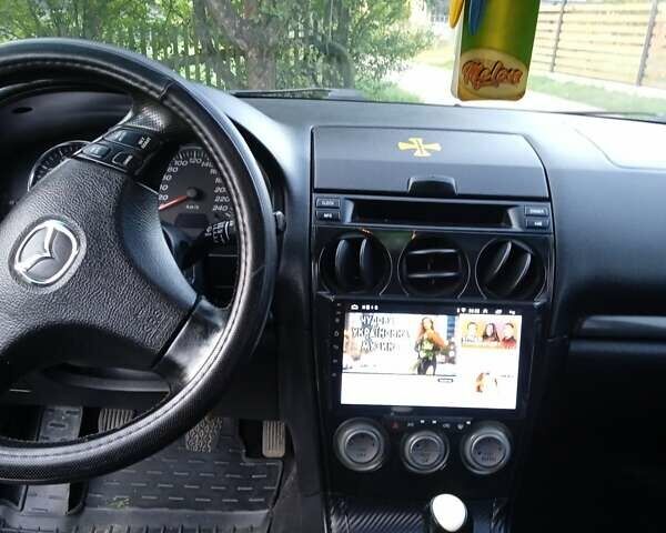 Синий Мазда 6, объемом двигателя 2 л и пробегом 443 тыс. км за 4700 $, фото 5 на Automoto.ua