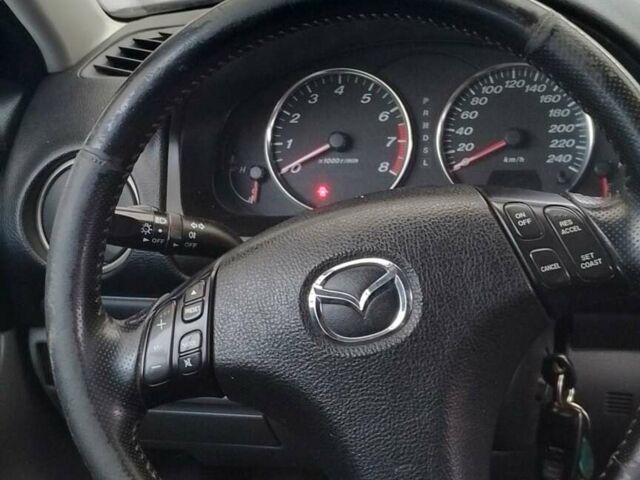 Синий Мазда 6, объемом двигателя 2 л и пробегом 300 тыс. км за 3900 $, фото 5 на Automoto.ua