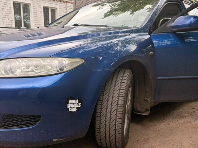 Синий Мазда 6, объемом двигателя 2 л и пробегом 210 тыс. км за 2610 $, фото 2 на Automoto.ua