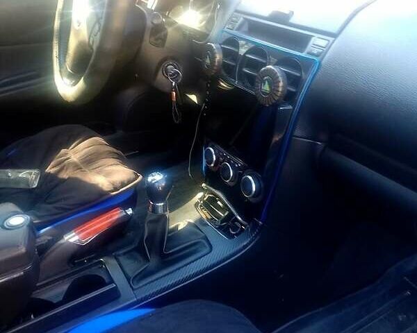 Синій Мазда 6, об'ємом двигуна 1.8 л та пробігом 245 тис. км за 4450 $, фото 2 на Automoto.ua