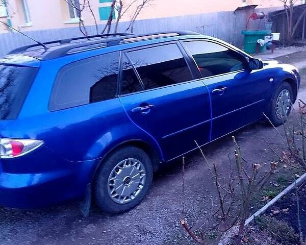 Синій Мазда 6, об'ємом двигуна 1.8 л та пробігом 245 тис. км за 4450 $, фото 5 на Automoto.ua