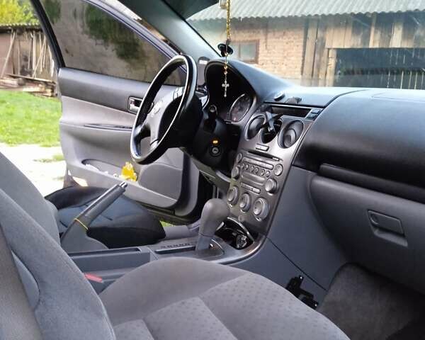 Синий Мазда 6, объемом двигателя 2 л и пробегом 218 тыс. км за 3800 $, фото 3 на Automoto.ua