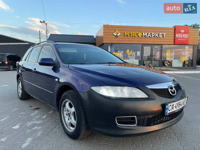Синий Мазда 6, объемом двигателя 2 л и пробегом 243 тыс. км за 2399 $, фото 1 на Automoto.ua